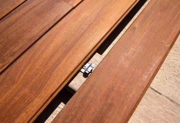 Contractors using innovative deck fastening systems for a smooth Trex decking installation in Canyon Country.