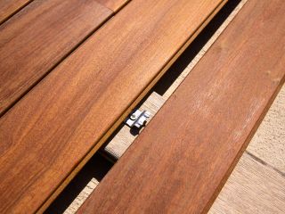 Contractors using innovative deck fastening systems for a smooth Trex decking installation in Canyon Country.